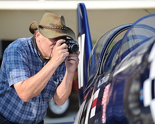 Jeff Lange | The Vindicator Airplane enthusiast Kevin Yurcheckfrodel takes a quick picture of the cockpit of a replica F4U Corsair, Saturday afternoon at the opening of the Ernie Hall Aviation Museum in Warren.