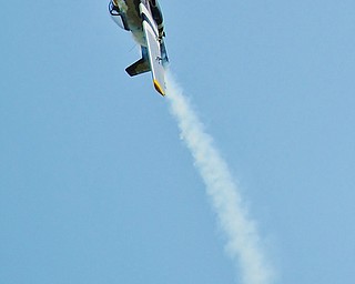 Jeff Lange | The Vindicator "The Pisser" a T-51 Mustang does a barrel roll during one of the many fly overs that occurred Saturday afternoon during the Wings and Wheels Fundraiser event at the Ernie Hall Aviation Museum.