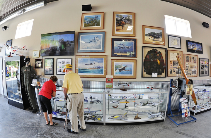 Jeff Lange | The Vindicator  An elderly couple admire the display of model planes at the Ernie Hall Aviation Museum, Saturday morning in Warren.