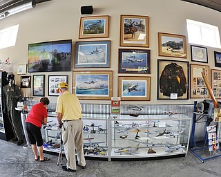 Jeff Lange | The Vindicator An elderly couple admire the display of model planes at the Ernie Hall Aviation Museum, Saturday morning in Warren.