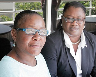 Marlene Pinnock, left, poses with her attorney, Caree Harper, during an interview Sunday in Los Angeles. Pinnock, a homeless woman, was beaten by a California Highway Patrol officer in July. Sunday was Pinnock’s first publicized interview since the incident, which was videotaped.