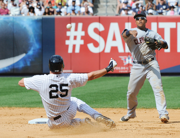 Indians shortstop Jose Ramirez relays the ball to first to complete a double play after forcing the Yankees’ Mark Teixeira out at second base to end the seventh inning of Sunday’s baseball game at Yankee Stadium in New York.
The Indians won 4-1.
