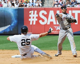 Indians shortstop Jose Ramirez relays the ball to first to complete a double play after forcing the Yankees’ Mark Teixeira out at second base to end the seventh inning of Sunday’s baseball game at Yankee Stadium in New York.
The Indians won 4-1.