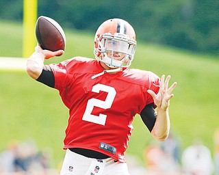 Cleveland Browns quarterback Johnny Manziel passes during practice Tuesday at the team’s training camp in Berea.
