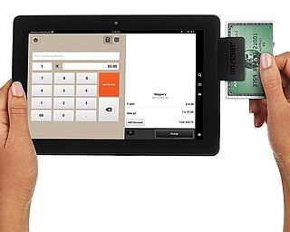 This product image provided by Amazon shows Amazon Local Register, the company’s new credit-card processing device and mobile app designed to help small-business owners accept payments through their smartphones and tablets.