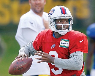 Steelers quarterback Ben Roethlisberger, top, watches as Bills quarterback Thad Lewis looks to pass a during a combined training camp session Wednesday in Latrobe, Pa. The Steelers and Bills square off Saturday in an
exhibition game at Heinz Field in Pittsburgh.