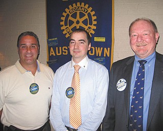 SPECIAL TO THE VINDICATOR
The Rotary Club of Austintown welcomed Justin Yost, above center, as its newest member on Aug. 11. Chuck Baker, right, performed the installation. Club President Vince Colaluca is on the left. Yost is a CPA with Bodnar and Perry in Canfield. Below are speakers Robert Gearhart Sr., left, and Robert Gearhart Jr., representing DC Wellness, which helps companies and individuals comply with Obamacare. Colaluca is on the right.