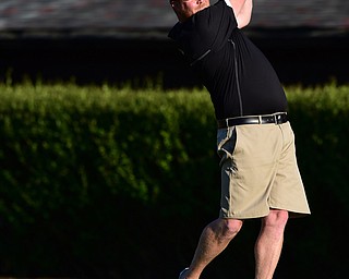 CANFIELD, OHIO - AUGUST 16, 2014: Jason Murdock follows through on his swing during the longest drive contest Saturday evening at Tippecanie Country Club. (Photo by David Dermer/Youngstown Vindicator)