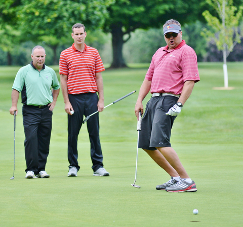 Jeff Lange | The Vindicator  Eric Ryan of Struthers (right), watches his missed putt go to the left of the hole as his teammates look on from behind.
