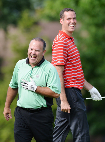 Jeff Lange | The Vindicator  Rick Leonard of Niles (left) and teammate share a moment of laughter together during play Monday afternoon at the Lake Club.
