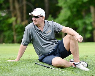 Jeff Lange | The Vindicator  Joe McHenry relaxes at the 17th tee as the group ahead finishes their hole, Monday afternoon at the Lake Club.