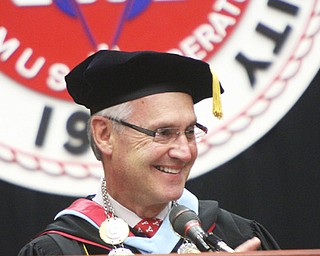 Jim Tressel is all smiles inside Beeghly Center during the ceremony for his formal installation as Youngstown State University’s ninth president.