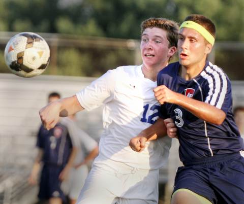 William D. Lewis the Vindicator  Poland's David Watson(12) and Fitch's Tony Mortaro(3) go for the ball during Tuesday 8-19-14 action at Poland.