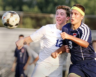 William D. Lewis the Vindicator Poland's David Watson(12) and Fitch's Tony Mortaro(3) go for the ball during Tuesday 8-19-14 action at Poland.