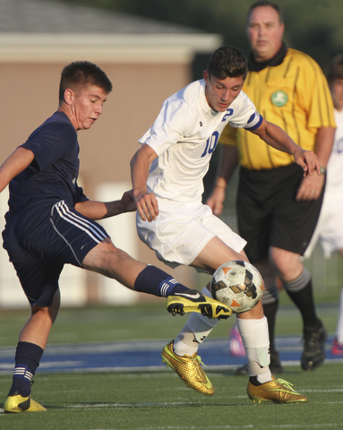 William D. Lewis the Vindicator  Poland's AnthonySabula(10) and Fitch's Drake Sahli(8) go for the ball during Tuesday 8-19-14 action at Poland.