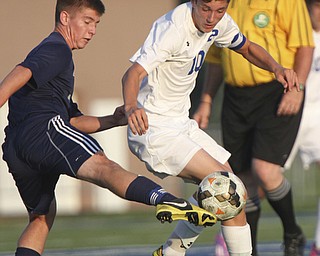 William D. Lewis the Vindicator  Poland's AnthonySabula(10) and Fitch's Drake Sahli(8) go for the ball during Tuesday 8-19-14 action at Poland.