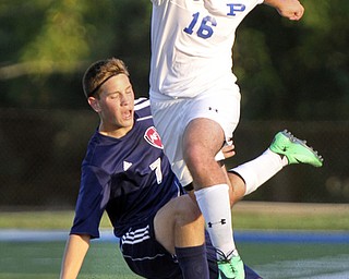 William D. Lewis the Vindicator  Poland's Kevin Cicuto(16) and Fitch'sAlex Kilpatrick(7) go for the ball during Tuesday 8-19-14 action at Poland.