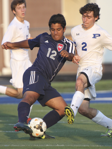 William D. Lewis the Vindicator  Poland's Bryan Partika(2) and Fitch's KDavid Watson(12) go for the ball during Tuesday 8-19-14 action at Poland.