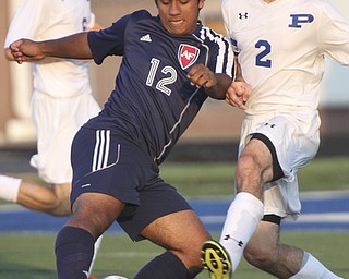 William D. Lewis the Vindicator Poland's Bryan Partika(2) and Fitch's KDavid Watson(12) go for the ball during Tuesday 8-19-14 action at Poland.