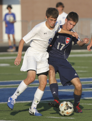 William D. Lewis the Vindicator  Poland's Ryan Weitzman(9) and Fitch's Kyle Cyphert(17) go for the ball during Tuesday 8-19-14 action at Poland.