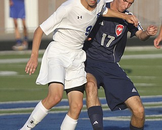 William D. Lewis the Vindicator  Poland's Ryan Weitzman(9) and Fitch's Kyle Cyphert(17) go for the ball during Tuesday 8-19-14 action at Poland.