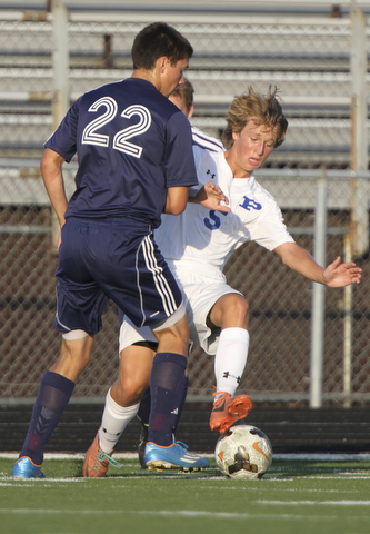 William D. Lewis the Vindicator  Poland'sMarcus Trevis(59) and Fitch's Wes Pringle(22) go for the ball during Tuesday 8-19-14 action at Poland.