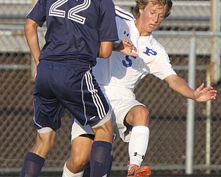 William D. Lewis the Vindicator  Poland'sMarcus Trevis(59) and Fitch's Wes Pringle(22) go for the ball during Tuesday 8-19-14 action at Poland.