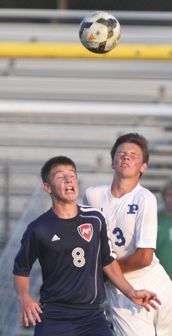 William D. Lewis the Vindicator  Poland's Evan Rumble(3) and Fitch's Drake Sahli(8) go for the ball during Tuesday 8-19-14 action at Poland.