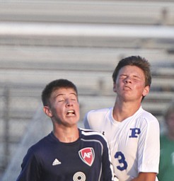 William D. Lewis the Vindicator  Poland's Evan Rumble(3) and Fitch's Drake Sahli(8) go for the ball during Tuesday 8-19-14 action at Poland.