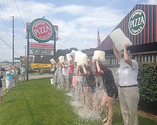 A dozen people participated in the Ice Bucket Challenge, an online campaign to raise money for the ALS Association, on Wednesday at Inner Circle Pizza in Poland in honor of Inner Circle co-founder John Conti, who died of ALS in 2010. His business partner, Don Larcinese, who still owns Inner Circle, participated in the challenge along with employees at the restaurant and friends of Conti .