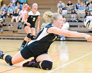 Warren Harding volleyball player Kristin Sampson goes to the floor to keep the ball in play during Wednesday’s contest against Howland. The Tigers won in four sets.