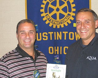 SPECIAL TO THE VINDICATOR
Peter Kusky, right, engineer for Aqua Ohio and an Austintown resident and Fitch alumnus, was the guest speaker at the Aug. 3 meeting of the Rotary Club of Austintown. He discussed the importance of a dependable water supply in light of the crisis in Toledo. He also said tap water is tested more than bottled water and is safer. Rotary President Vince Colaluca, left, presented Kusky with a book in honor of his visit. It will be donated to the Austintown Elementary School Library.
