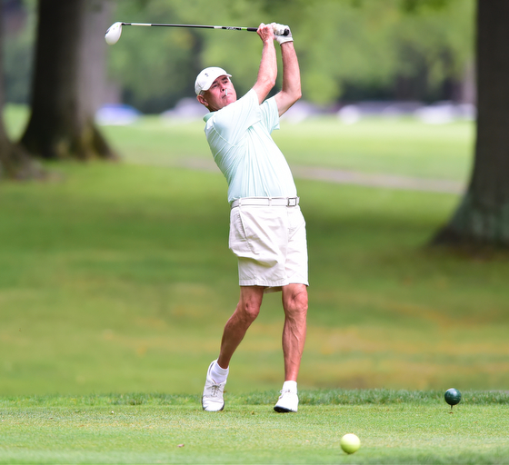 BOARDMAN, OHIO - AUGUST 22, 2014: Jon Mrus of Warren tees off on the 10th hole on the south course Friday morning at Mill Creek Golf Course during the Vindy Greatest Golfer Tournament. (Photo by David Dermer/Youngstown Vindicator)