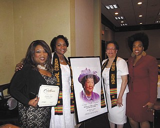 SPECIAL TO THE VINDICATOR
Sandra Fulton Britt was installed recently as president of the Youngstown Section of the National Council of Negro Women for 2014-2015. Above, from left, are Michelle Nicks, 21 WFMJ-TV reporter; Britt; photo of Dr. Dorothy Irene Height, 40-year president of NCNW; Yvonne Wilson, immediate past president; and Dr. Cryshanna Jackson Leftwich, luncheon speaker.