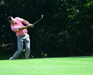 YOUNGSTOWN, OHIO - AUGUST 23, 2014: Dan Ramun follows through on his approach shot on a hole on the back 9 of the Youngstown Country Club during the Vindy Greatest Golfer Tournament. (Photo by David Dermer/Youngstown Vindicator)