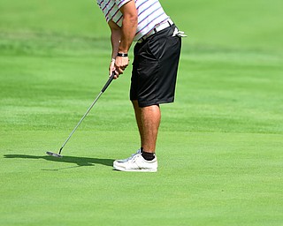 YOUNGSTOWN, OHIO - AUGUST 23, 2014: Matt Gurska follows through on his putt on a hole on the back 9 of the Youngstown Country Club during the Vindy Greatest Golfer Tournament. (Photo by David Dermer/Youngstown Vindicator)