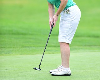 YOUNGSTOWN, OHIO - AUGUST 23, 2014: Mary Kane follows through on her putt on the front 9 of the Youngstown Country Club during the Vindy Greatest Golfer Tournament. (Photo by David Dermer/Youngstown Vindicator)