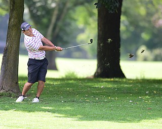 YOUNGSTOWN, OHIO - AUGUST 23, 2014: Matt Gurska chips out of the short rough on a hole on the back 9 of the Youngstown Country Club during the Vindy Greatest Golfer Tournament. (Photo by David Dermer/Youngstown Vindicator)