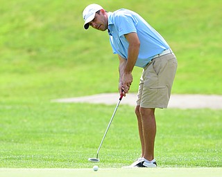 YOUNGSTOWN, OHIO - AUGUST 23, 2014: Scott Porter follows through on his putt on the back 9 of the Youngstown Country Club during the Vindy Greatest Golfer Tournament. (Photo by David Dermer/Youngstown Vindicator)