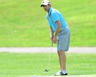 YOUNGSTOWN, OHIO - AUGUST 23, 2014: Lawson Dripps follows through on his putt on the back 9 of the Youngstown Country Club during the Vindy Greatest Golfer Tournament. (Photo by David Dermer/Youngstown Vindicator)
