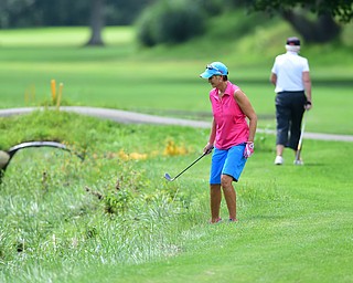 YOUNGSTOWN, OHIO - AUGUST 23, 2014: Tony Notaro searches for a golf ball that was hit into the creek on the front 9 of the Youngstown Country Club during the Vindy Greatest Golfer Tournament. (Photo by David Dermer/Youngstown Vindicator)
