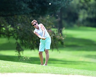YOUNGSTOWN, OHIO - AUGUST 23, 2014: Pam Volosin chips onto the green from the fairway on the front 9 of the Youngstown Country Club during the Vindy Greatest Golfer Tournament. (Photo by David Dermer/Youngstown Vindicator)