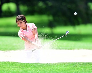 YOUNGSTOWN, OHIO - AUGUST 23, 2014: Felicia Drevna shoots out of the bunker on the front 9 of the Youngstown Country Club during the Vindy Greatest Golfer Tournament. (Photo by David Dermer/Youngstown Vindicator)