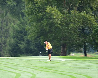 WARREN, OHIO - AUGUST 23, 2014: Dave Tabak of Poland follows through on his approach shot on the 1st hole Saturday morning at Trumbull Country Club during the Vindy Greatest Golfer Tournament. (Photo by David Dermer/Youngstown Vindicator)
