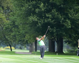 WARREN, OHIO - AUGUST 23, 2014: Griffin Todd of Canfield follows through on his approach shot on the 1st hole Saturday morning at Trumbull Country Club during the Vindy Greatest Golfer Tournament. (Photo by David Dermer/Youngstown Vindicator)
