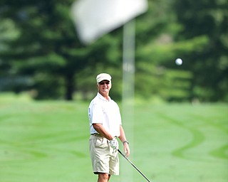 WARREN, OHIO - AUGUST 23, 2014: Ray Duffett of Canfield watches as his ball drops on the green after his approach shot on the 1st hole Saturday morning at Trumbull Country Club during the Vindy Greatest Golfer Tournament. (Photo by David Dermer/Youngstown Vindicator)