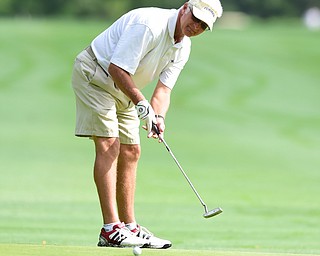 WARREN, OHIO - AUGUST 23, 2014: Ray Duffett of Canfield watches as his putt breaks toward the hole on the 1st hole Saturday morning at Trumbull Country Club during the Vindy Greatest Golfer Tournament. (Photo by David Dermer/Youngstown Vindicator)