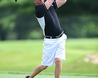 WARREN, OHIO - AUGUST 23, 2014: Brian Carnie follows through on his tee shot on the 2nd hole Saturday morning at Trumbull Country Club during the Vindy Greatest Golfer Tournament. (Photo by David Dermer/Youngstown Vindicator)