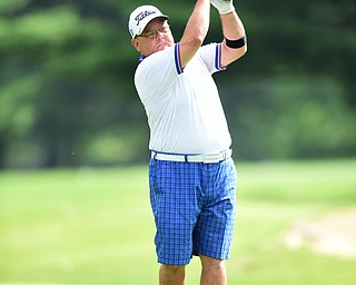 WARREN, OHIO - AUGUST 23, 2014: Jerry Ferrell Sr. follows through on his tee shot on the 2nd hole Saturday morning at Trumbull Country Club during the Vindy Greatest Golfer Tournament. (Photo by David Dermer/Youngstown Vindicator)