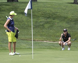  .          ROBERT  K. YOSAY | THE VINDICATOR..Toni Notaro talks about the green on the 18th hole as Katie Rogner lines up her putt....GGOV at The Lake Club in Poland -...-30-